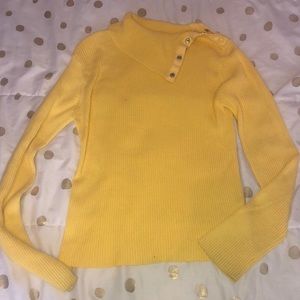 Yellow children’s turtleneck with snaps